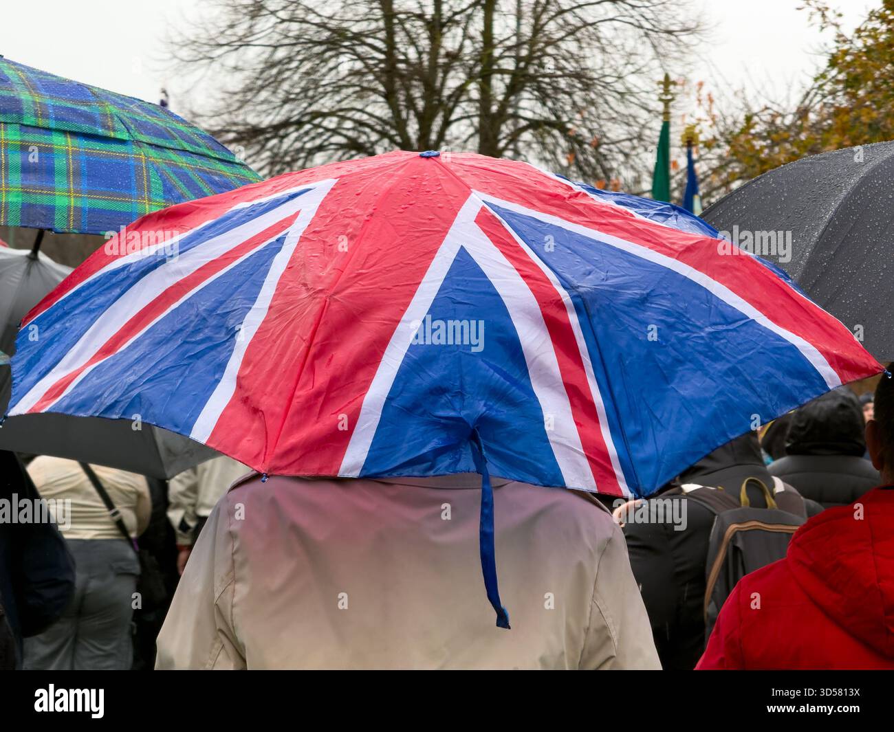 Ormskirk Remembrance Parade, Ormskirk Lancashire UK UK. Despite the pouring rain many people turned out mark the occasion and pay their respects. Nove - Smartphone Captured Stock Image