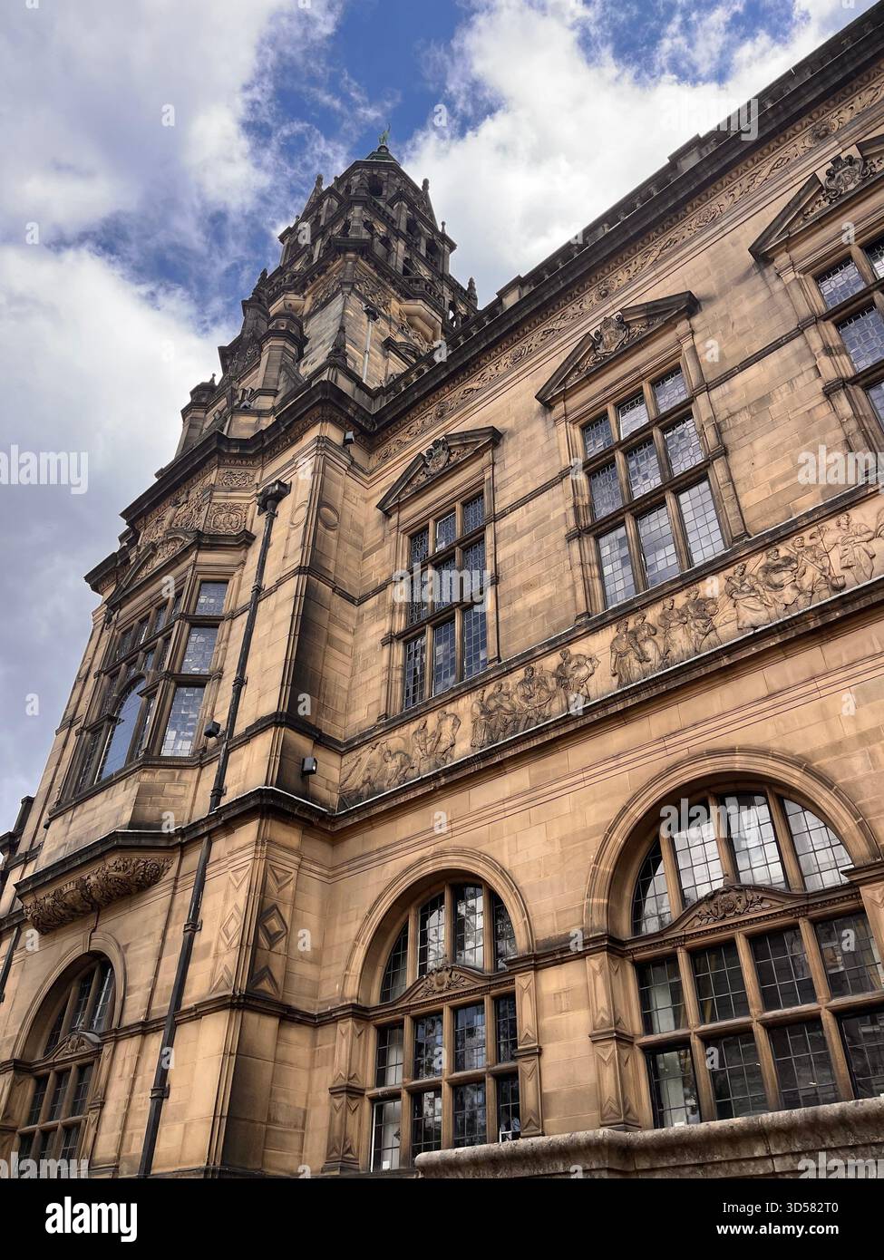 A grand historic stone building in Sheffield, England, photographed from a low angle against a bright sky. - Smartphone Captured Stock Image