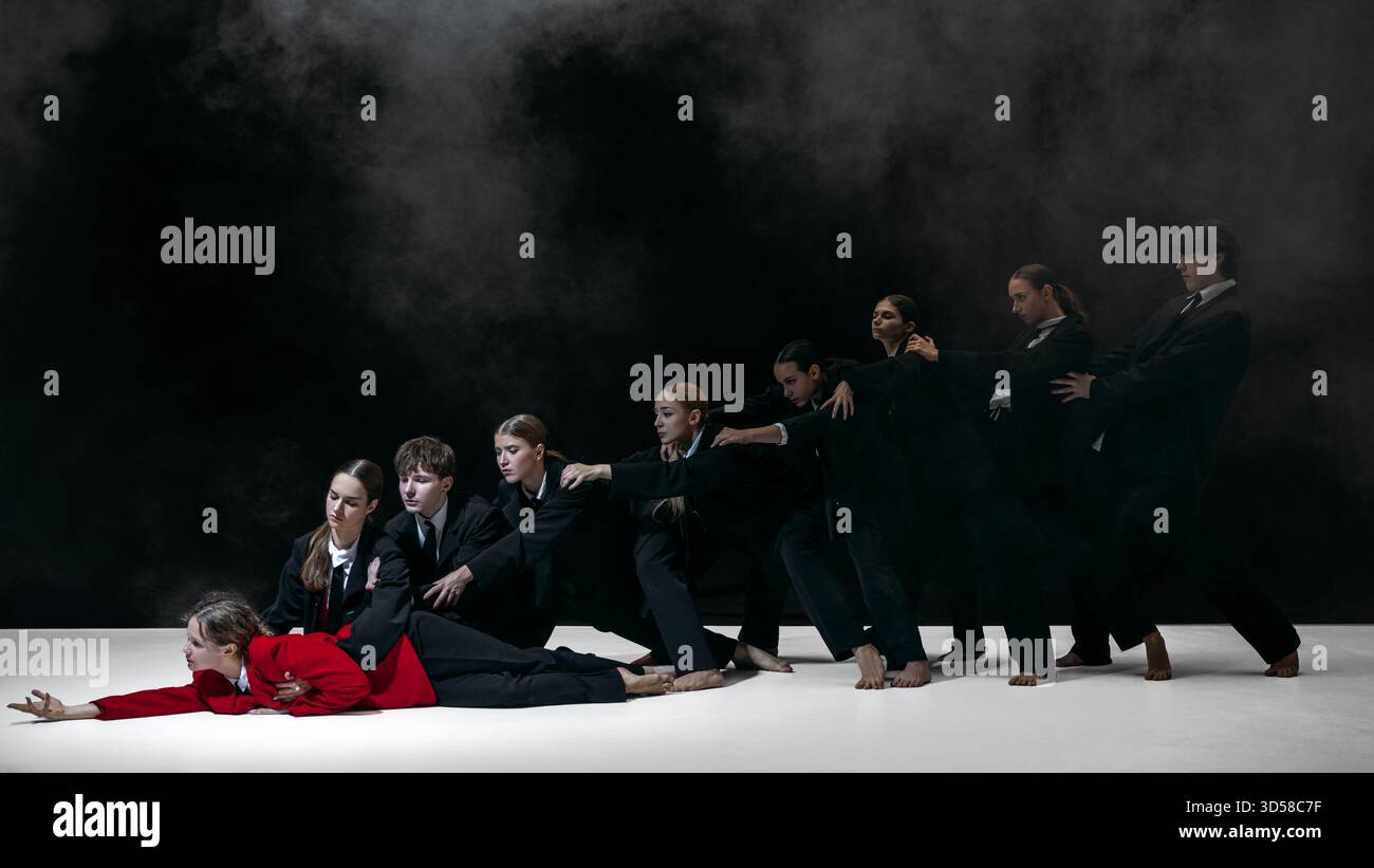 Business team dragging leader in red coat symbolizing social pressure ...