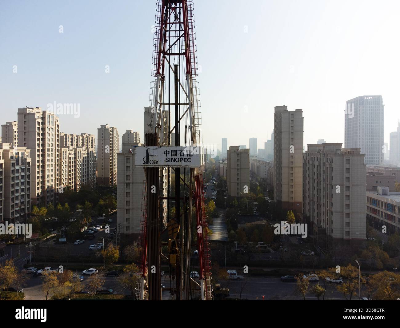 Sinopec Rig Picture Sinopec Urban Oil Rig Rising Above Residential Avenue in China Stock ...