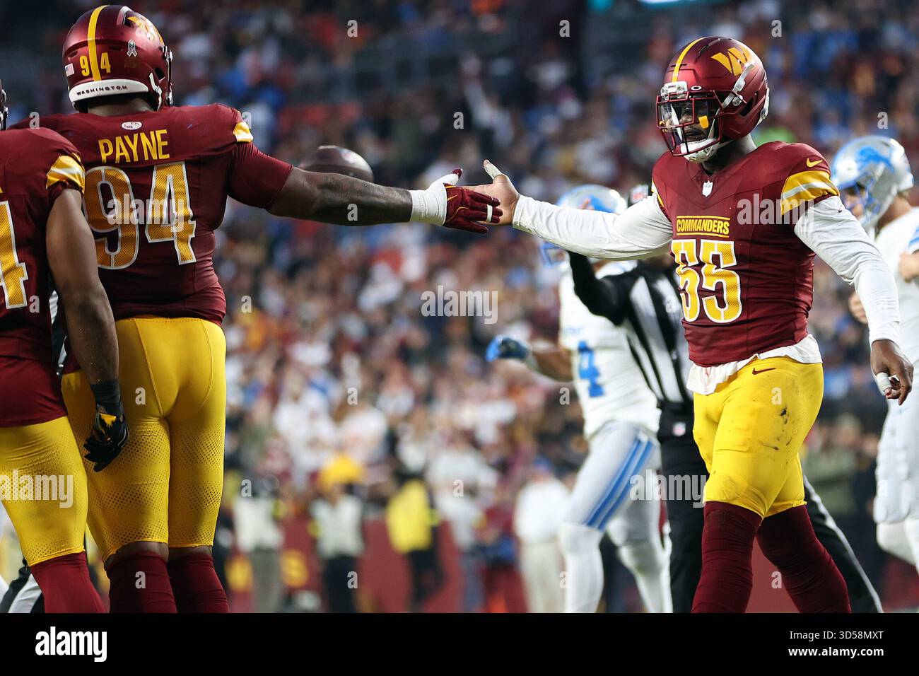 Washington Commanders defensive end Jacob Martin (55) celebrates with ...