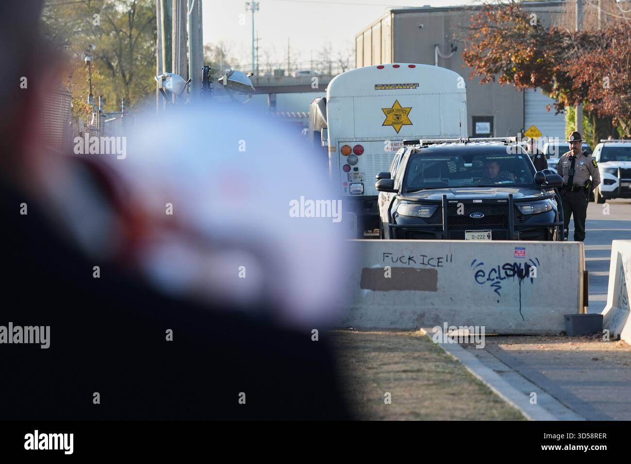 Police guard as protesters gather outside an ICE processing facility in ...