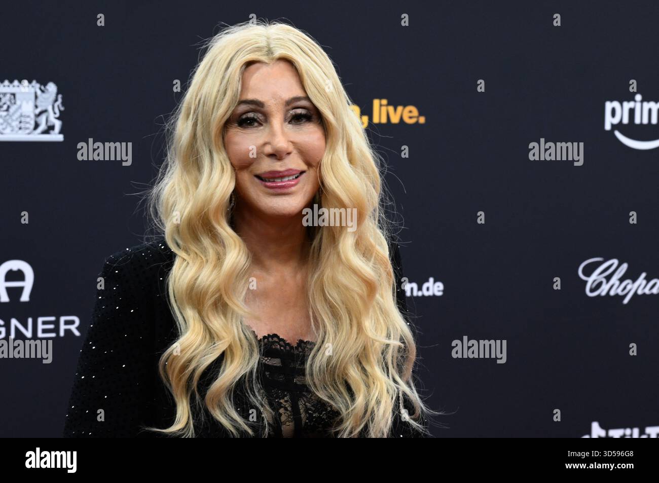 13 November 2025, Bavaria, Grünwald: Singer Cher walks the red