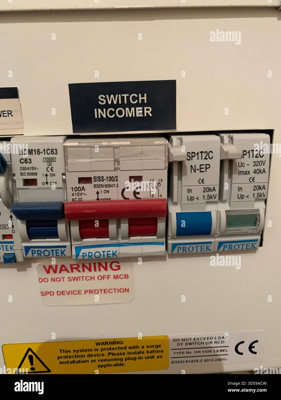 Electric box consumer unit danger electric shock electrical switch switches damaged front trip trips isolator taped live wires wired sign signs kill - Smartphone Captured Stock Image