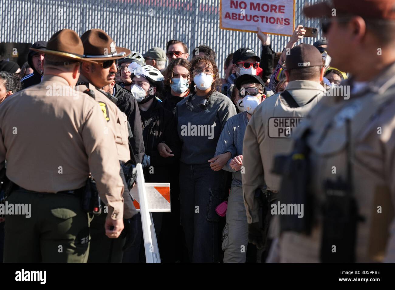 Protesters gather as Illinois State Police and Cook County Sheriff ...
