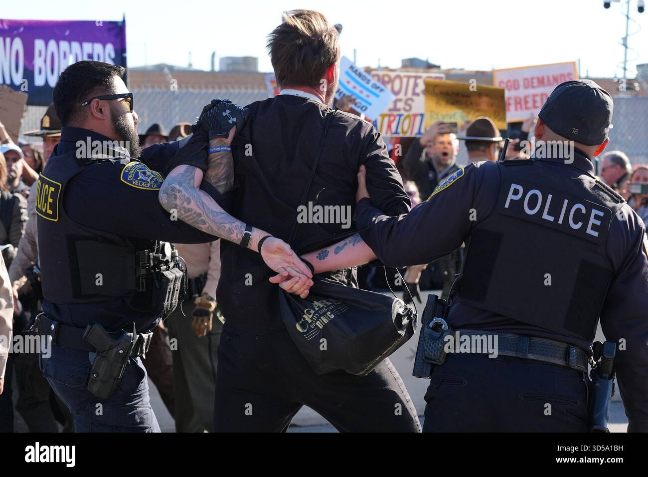 Broadview Police detain a protester outside an ICE processing facility ...
