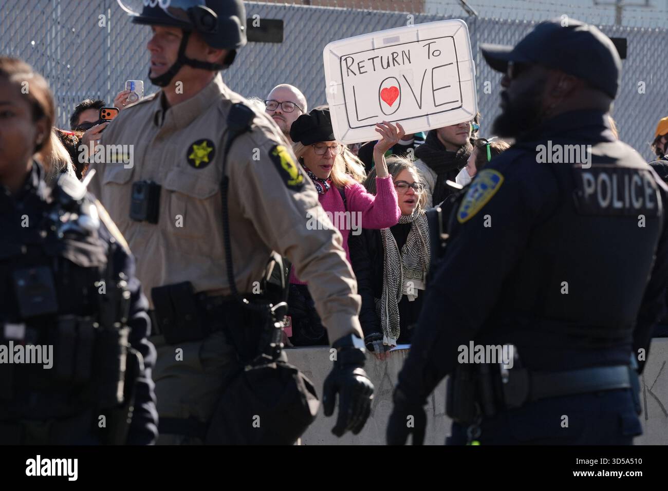 Police guard as protesters gather outside an ICE processing facility in ...