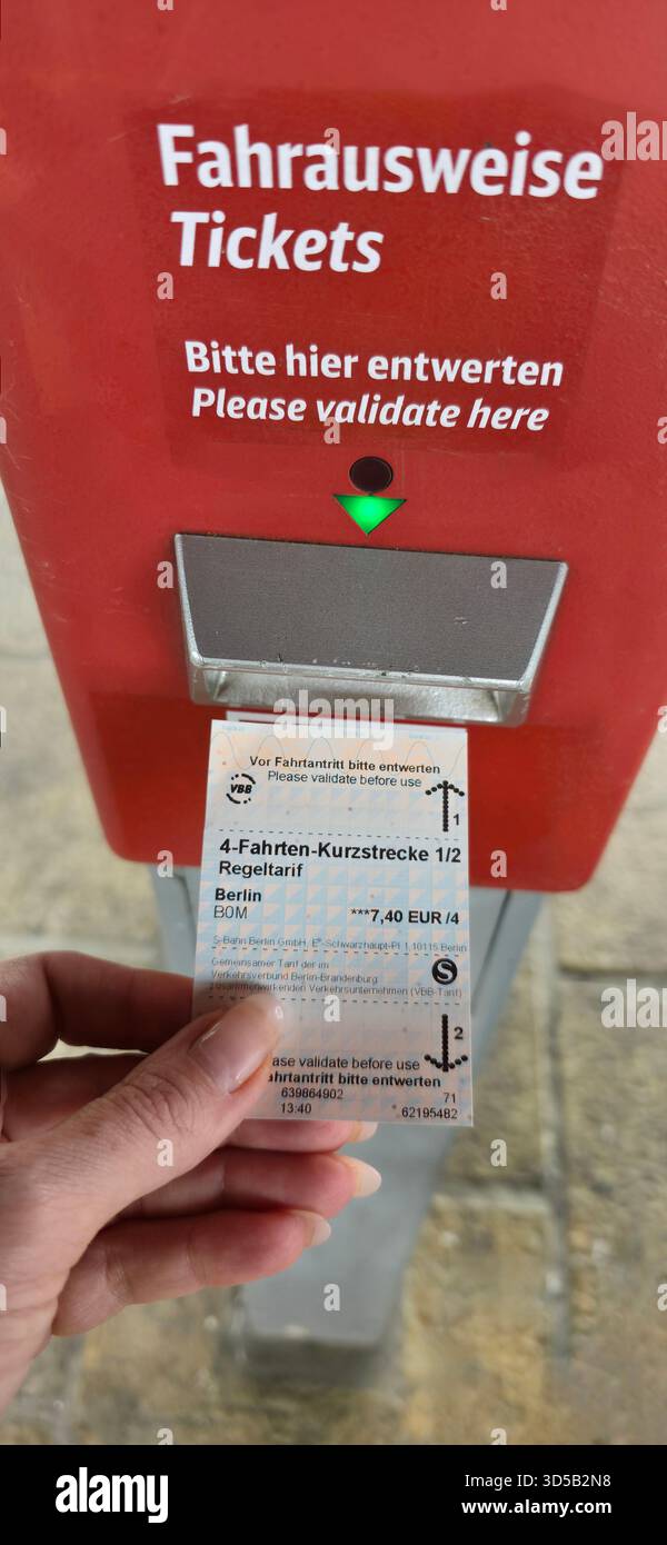 Berlin, Germany - June 27, 2025: . Ticket validation machine in Berlin showing travel card being validated for public transport use - Smartphone Captured Stock Image