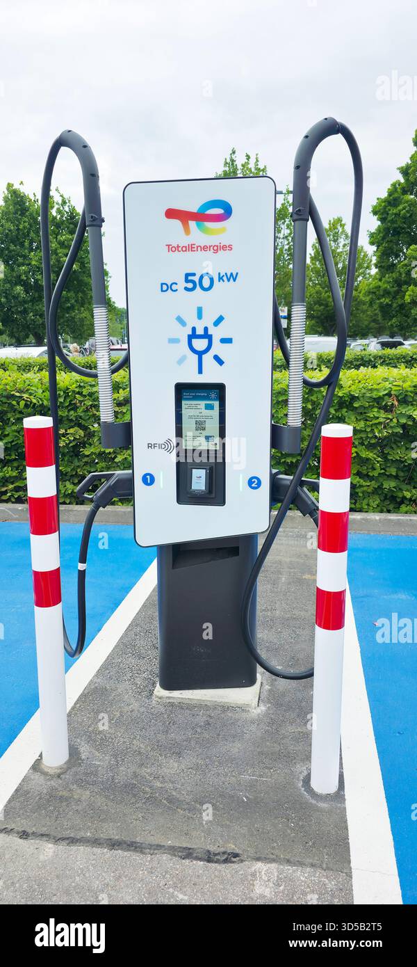 Berlin, Germany - June 28, 2025: TotalEnergies EV charging station features modern design and user-friendly interface in outdoor setting. - Smartphone Captured Stock Image