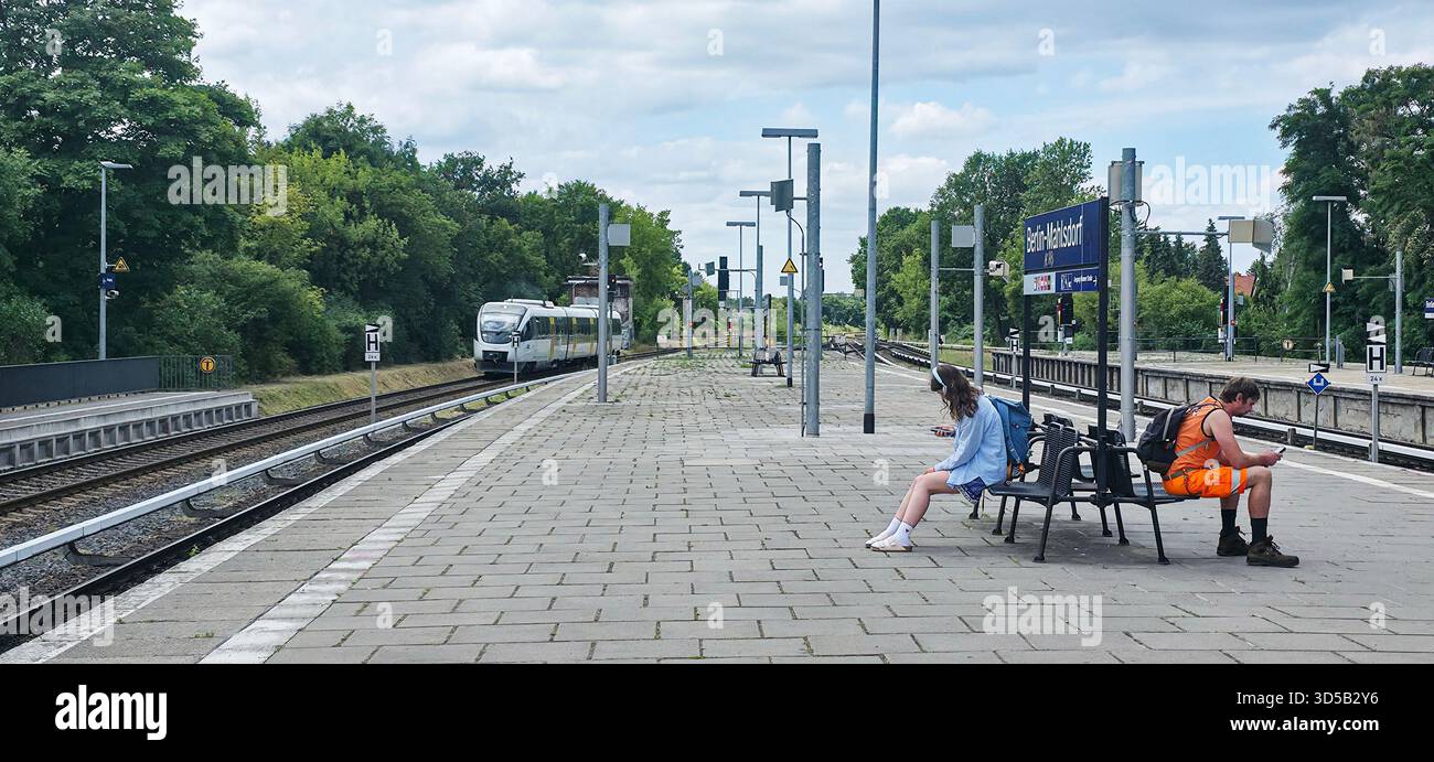 Berlin, Germany - July 03, 2025: . Train station platform features passengers waiting for train arrival on a sunny day - Smartphone Captured Stock Image