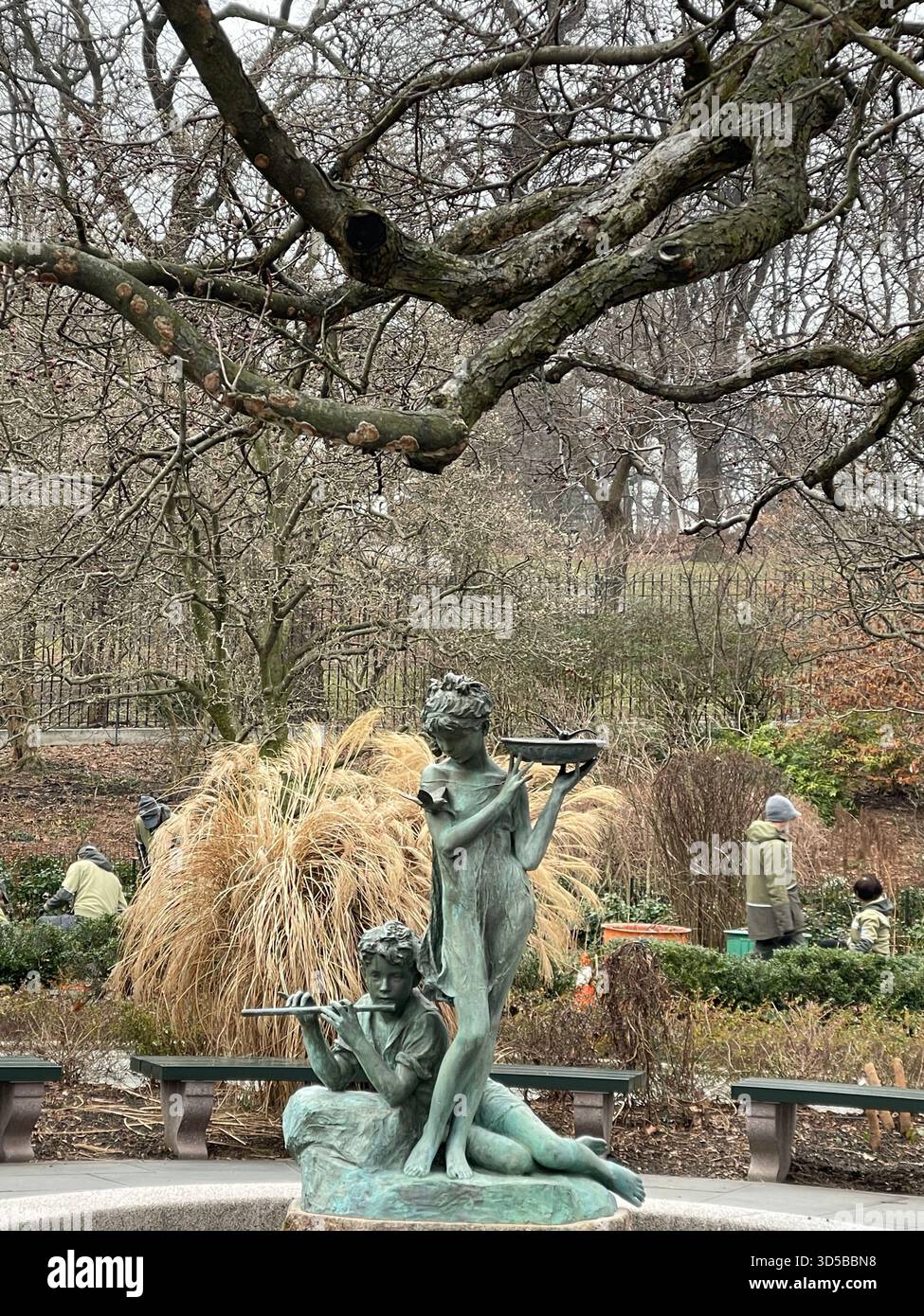 Fall colors highlight the Burnette Statue, blending history and nature in a picturesque moment. - Smartphone Captured Stock Image