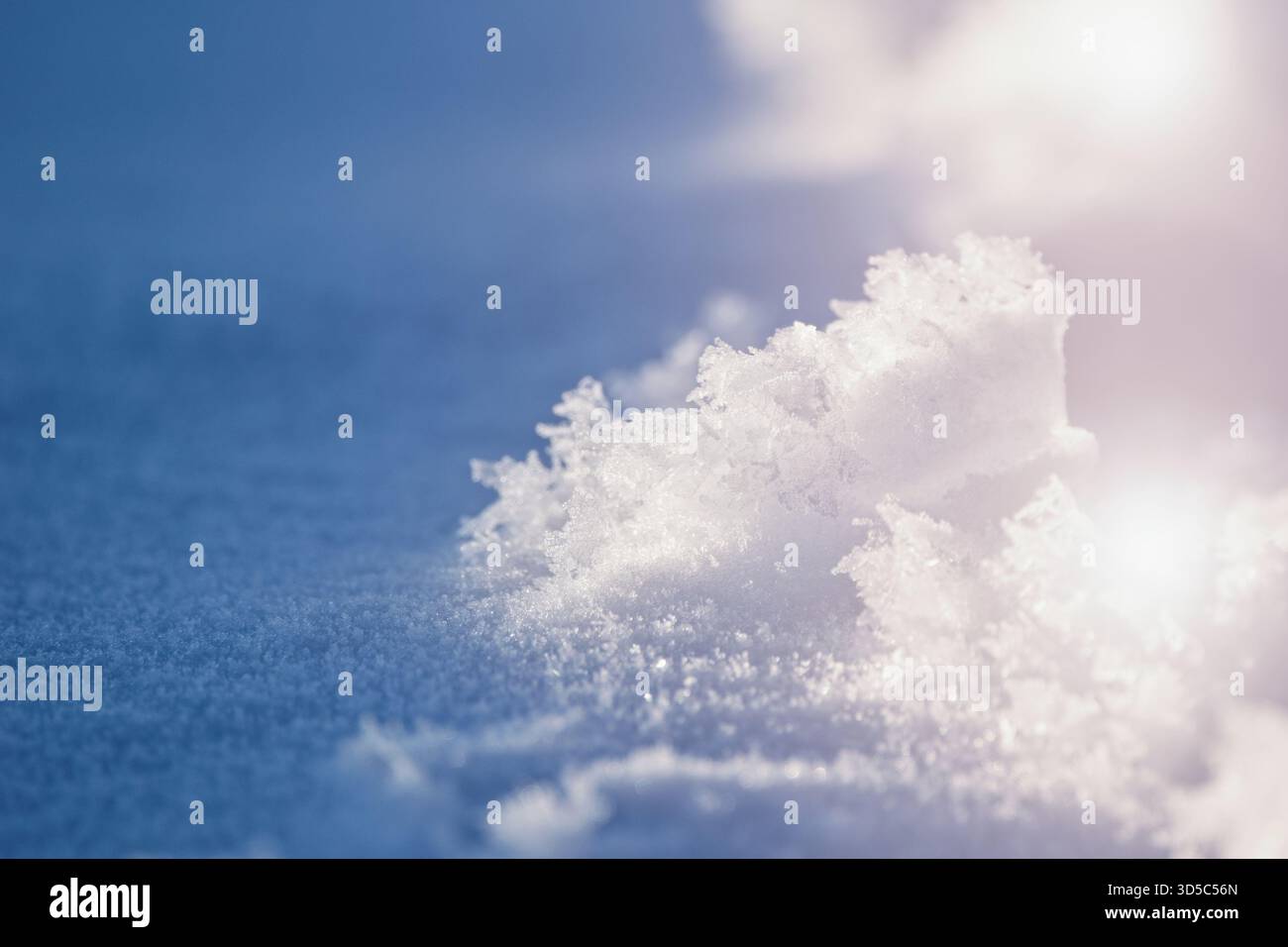 Crystalic fresh snow, shadows and light as abstract background Stock Photo