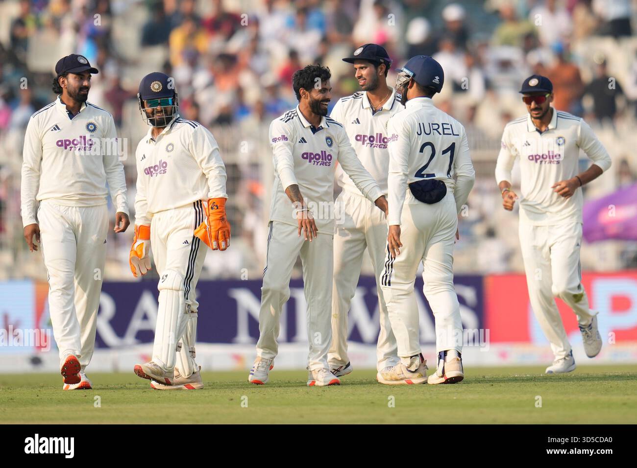 India's Ravindra Jadeja, center, celebrates with teammates after the ...