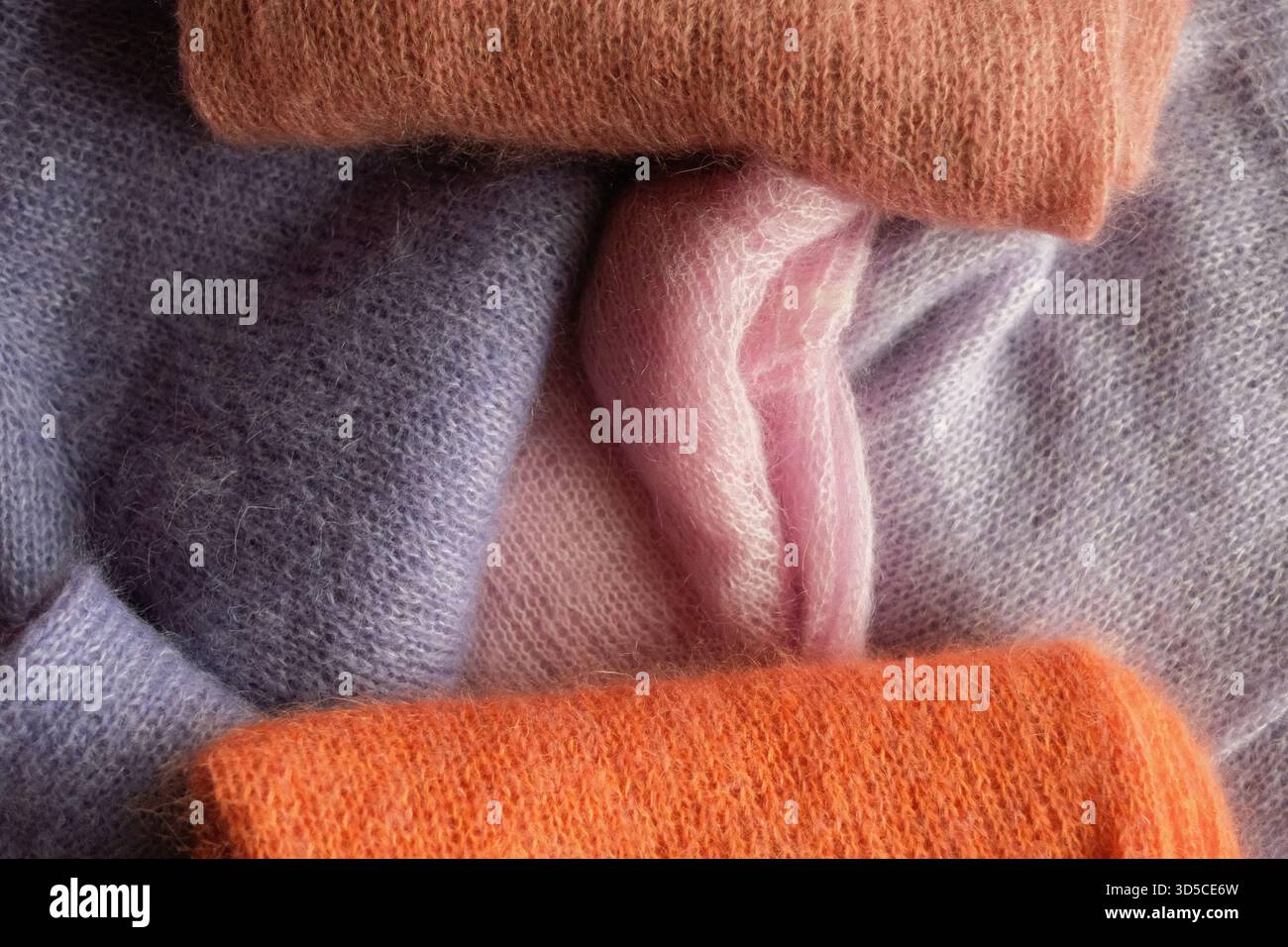 knitted sweaters in different colours Stock Photo