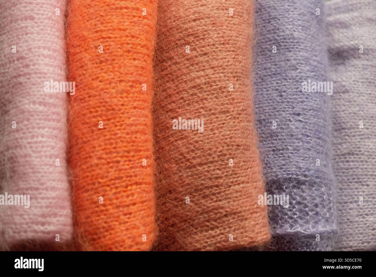 knitted sweaters in different colours Stock Photo