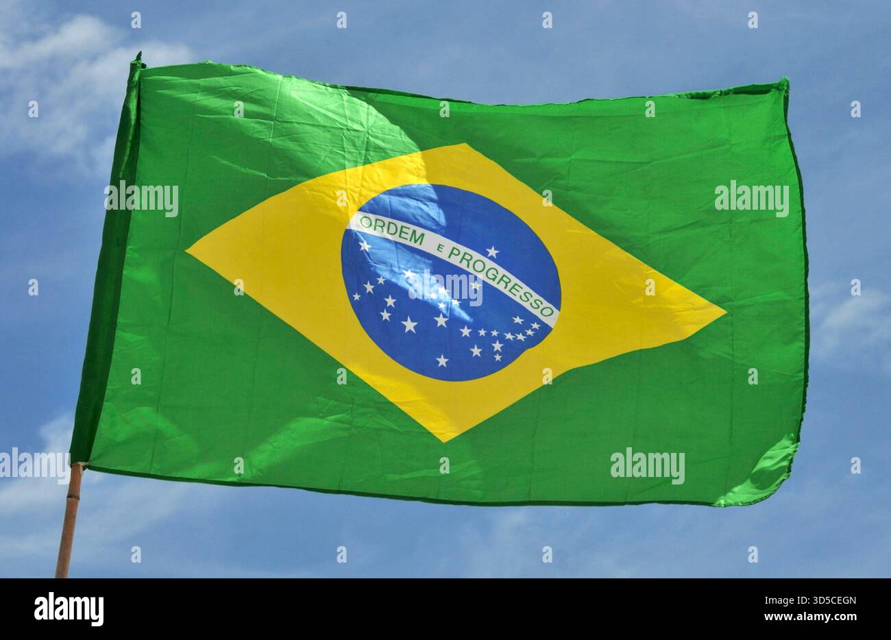 All Brazil Flags brazilian flag in blue sky Stock Photo - Alamy