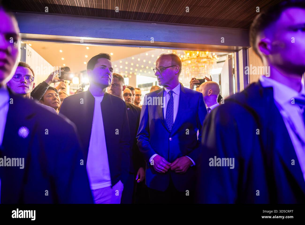 Rust, Germany. 15th Nov, 2025. Johannes Winkel (l, CDU), Federal Chairman of the Junge Union (JU), and Federal Chancellor Friedrich Merz (CDU) arrive at the event hall during the Junge Union's Germany Day. The main topic of the three-day congress is likely to be the reform of the social systems. Credit: Philipp von Ditfurth/dpa/Alamy Live News Stock Photo