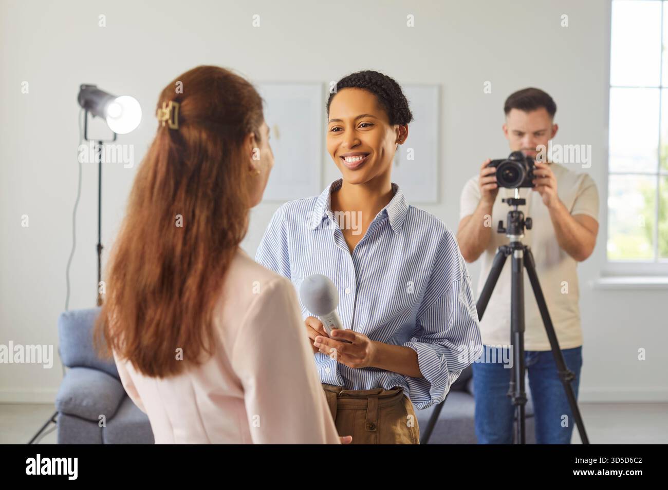 Journalist Interview Process Professional woman journalist recording interview, holding microphone ...
