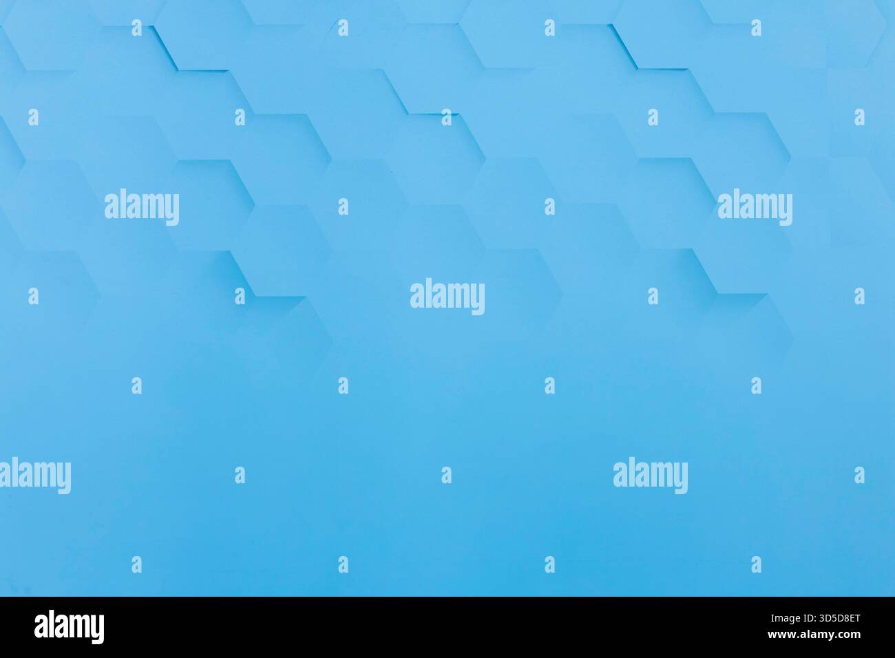 Blue background with hexagon shaped shadows on it Stock Photo