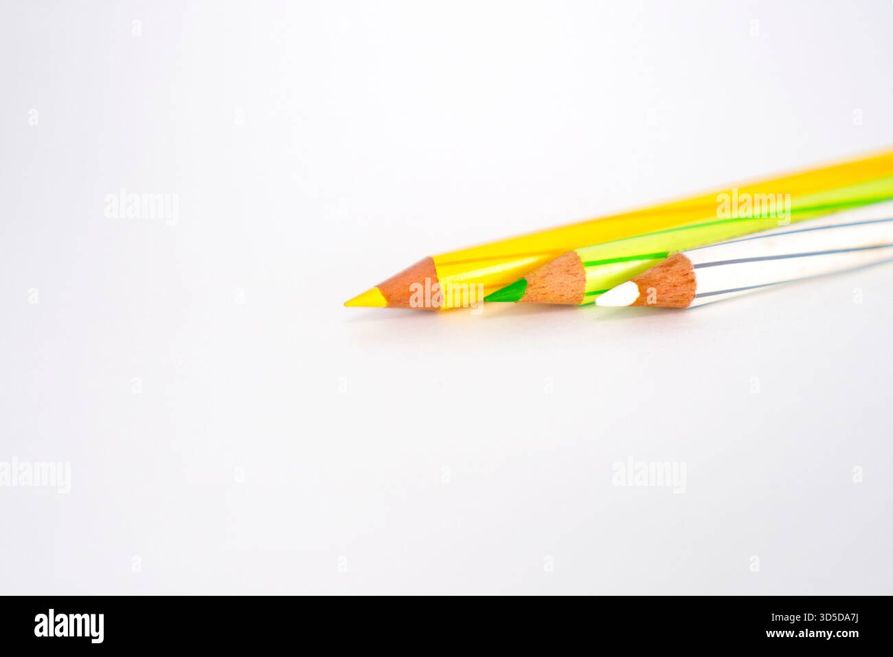 Multi colour pencils on white background Stock Photo