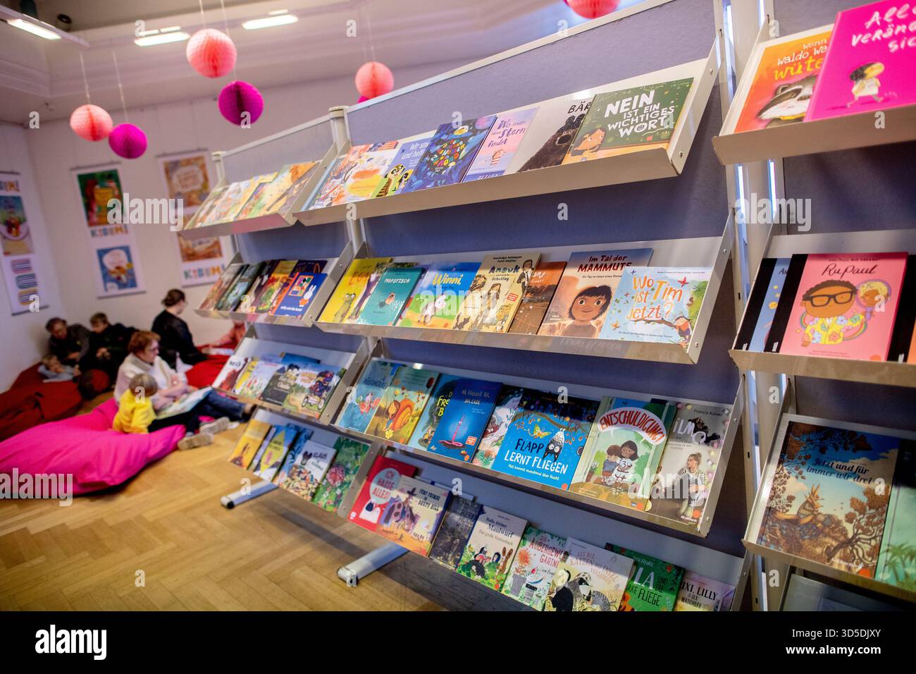 Oldenburg, Germany. 15th Nov, 2025. Numerous children's books lie on a shelf in the PFL cultural center at the KIBUM children's and young adult book fair. The 51st edition of the children's book fair in Oldenburg opens on 15.11.2025 with the program 'Body and Soul: KIBUM moves!'. Credit: Hauke-Christian Dittrich/dpa/Alamy Live News Stock Photo