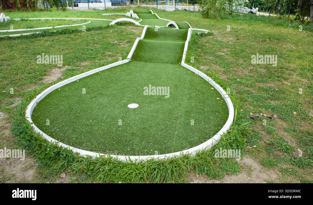 Golf Course Ramp Mini golf course with artificial turf and ramps view of the hole and ...