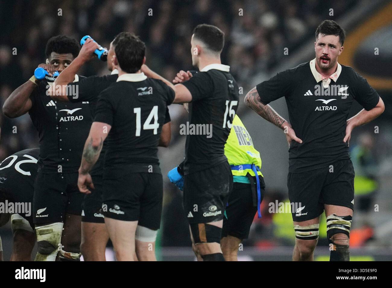 New Zealand Josh Lord, right, is bleeding as teammates take ...