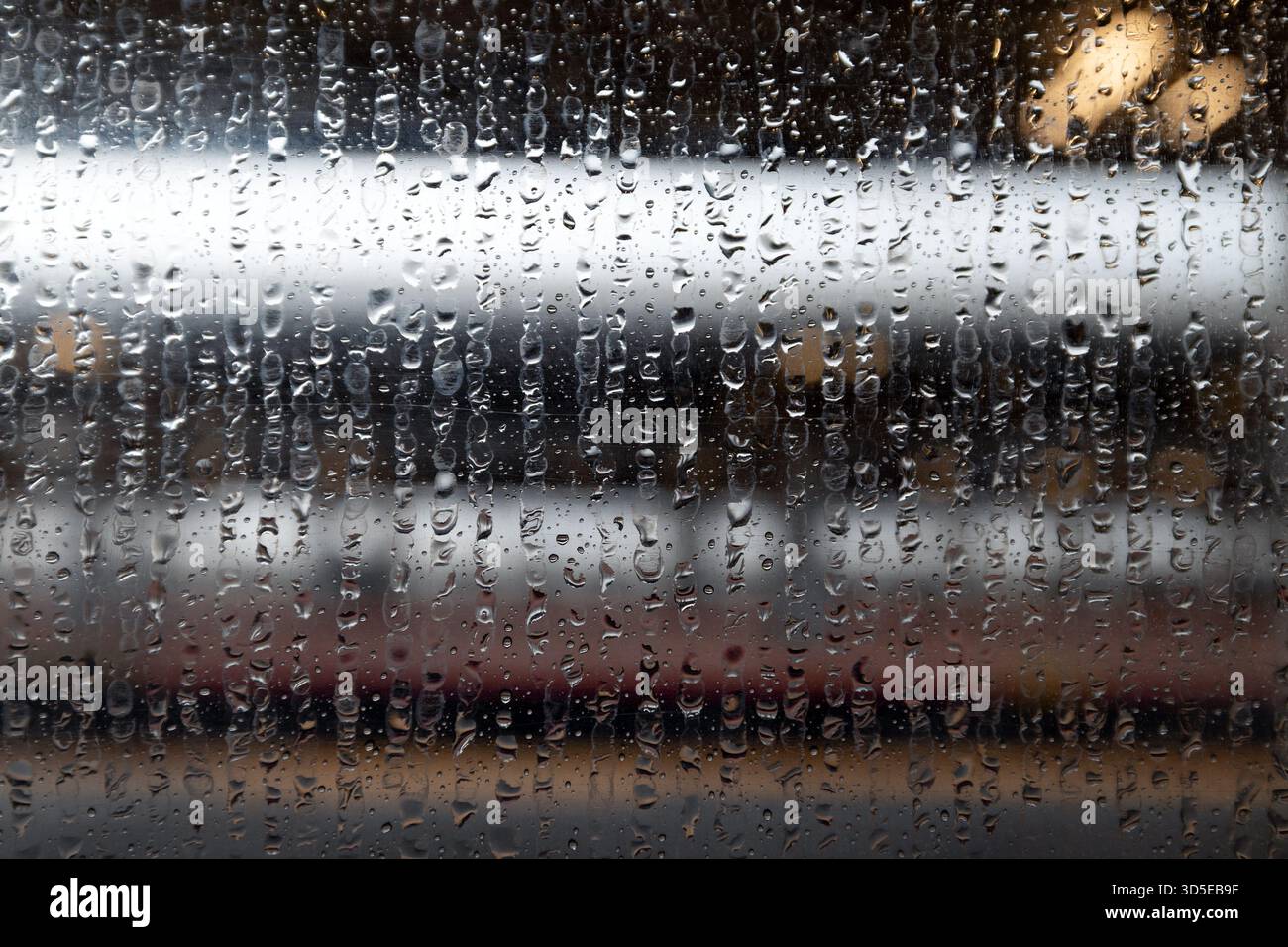 Train Station View Through Rain Covered Window Stock Photo