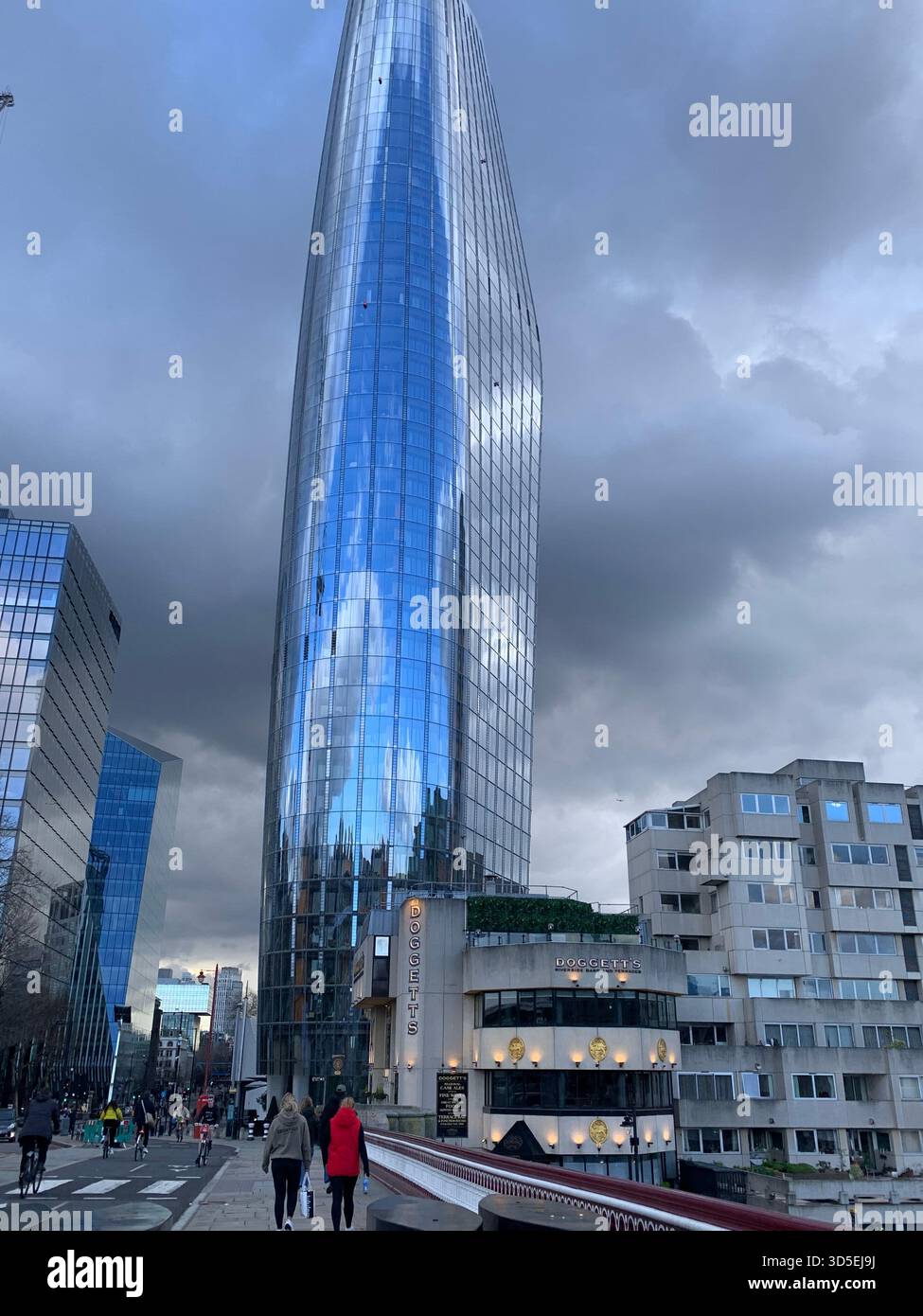 A striking view of the modern One Blackfriars skyscraper, also known as “The Vase,” rising above the South Bank area of London. - Smartphone Captured Stock Image