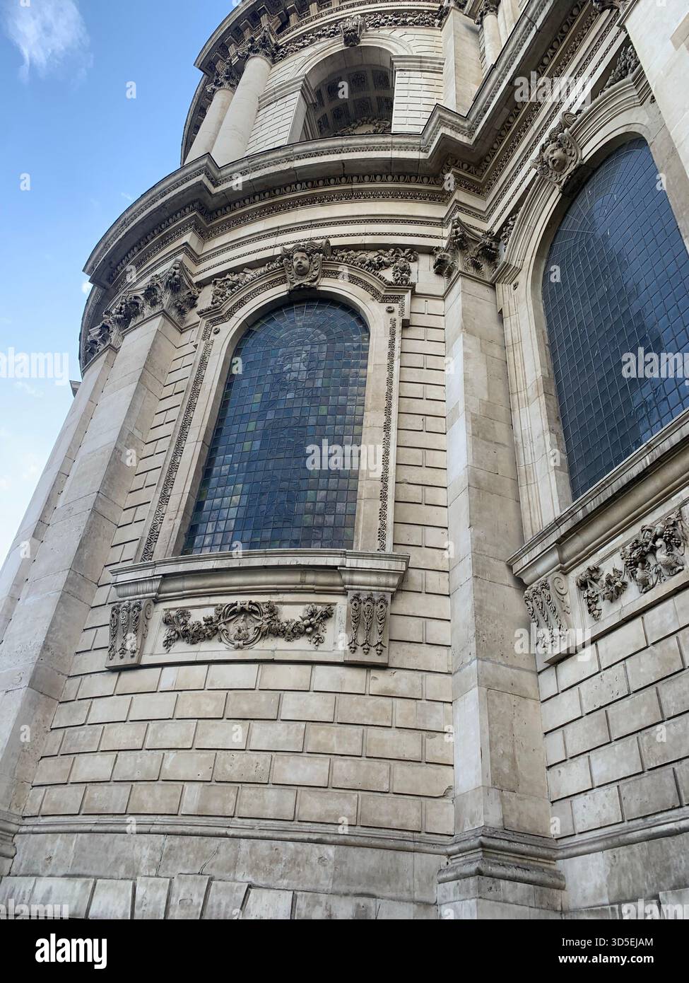 A close-up shot of the ornate architectural elements of St Paul’s Cathedral, showcasing its stone carvings, arched windows, - Smartphone Captured Stock Image