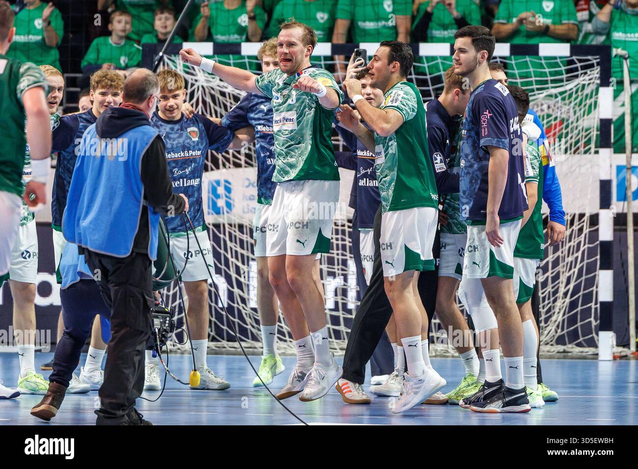 Berlin, Germany. 15th Nov, 2025. Handball: Bundesliga, Füchse Berlin - THW Kiel, Matchday 12, Max-Schmeling-Halle. Max Darj (M, Füchse Berlin) and teammates celebrate after the win. Credit: Andreas Gora/dpa/Alamy Live News Stock Photo