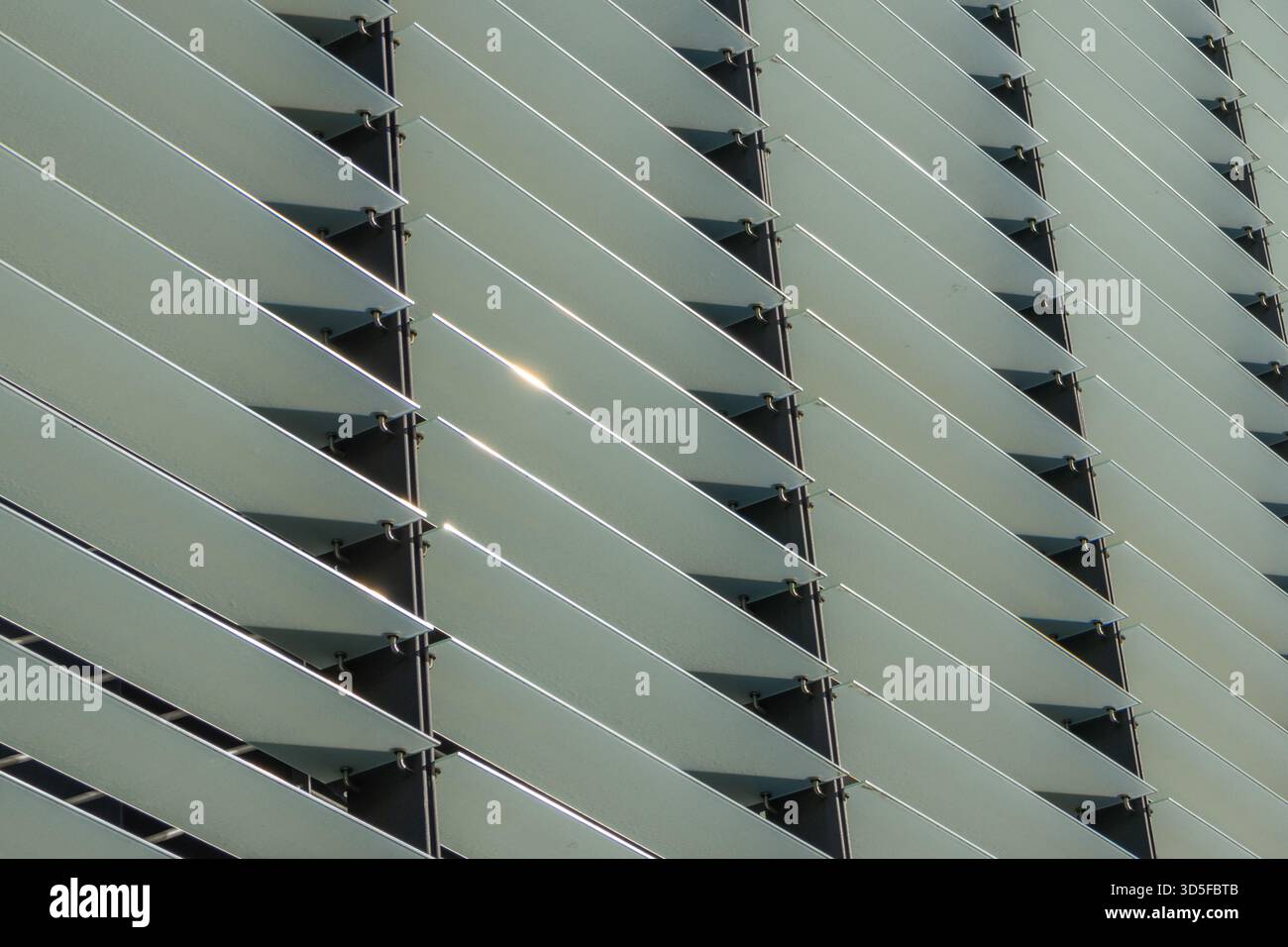 Irregular Pattern Louvers Metal louvers forming a repetitive architectural pattern on a building ...