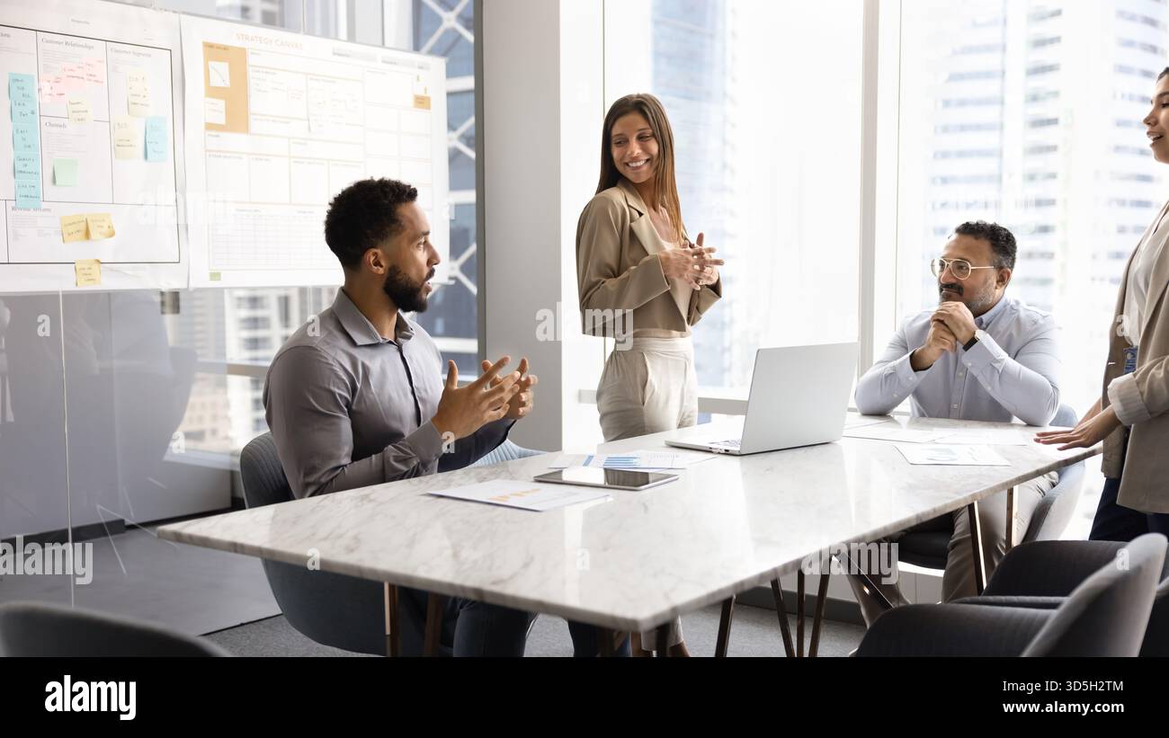 Diverse business team working on project together Stock Photo