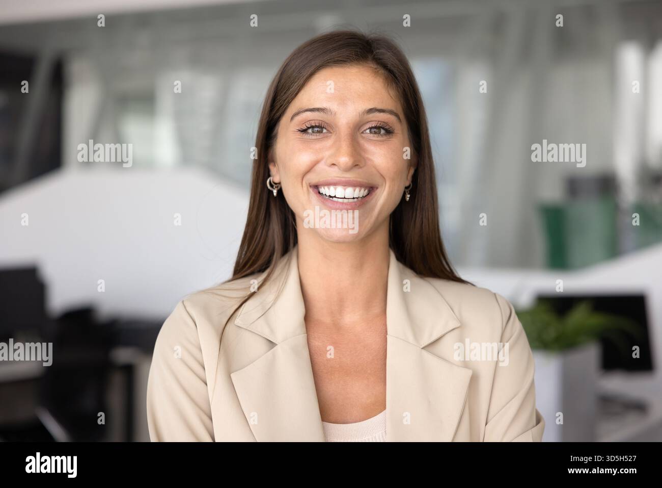 Cheerful attractive Hispanic business professional woman posing for portrait Stock Photo