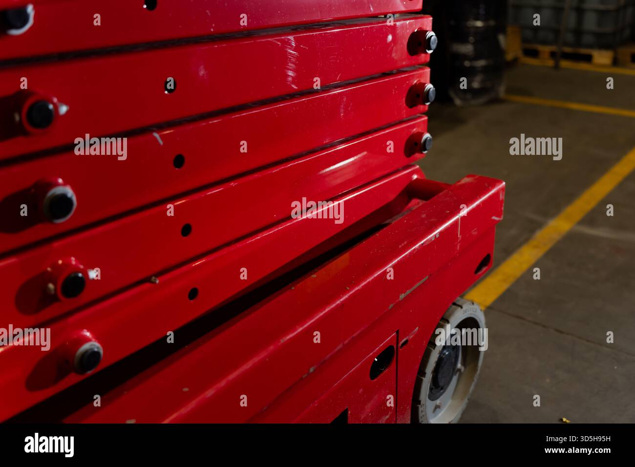 Heavy duty lift platform linkage painted in red finish with multiple ...