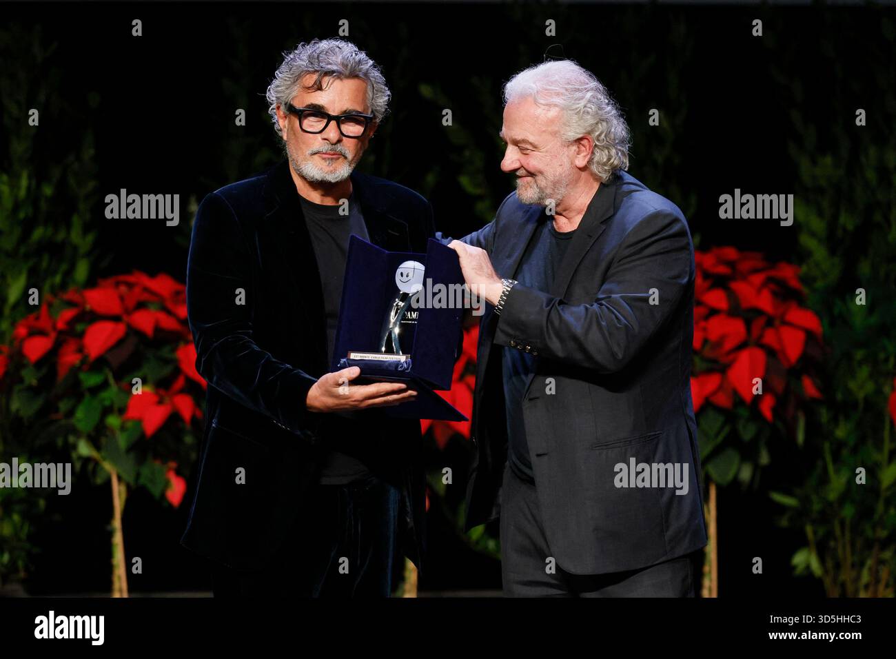 Monte Carlo, Monaco. 15th Nov, 2025. Paolo Genovese receives the Career Award from Giovanni Veronesi and Ezio Greggio the awards gala night held at Grimaldi Forum during 22nd Monte Carlo Film Festival on November 15, 2025 in Monte Carlo, Monaco. Photo Marco Piovanotto/ABACAPRESS.COM Credit: Abaca Press/Alamy Live News Stock Photo