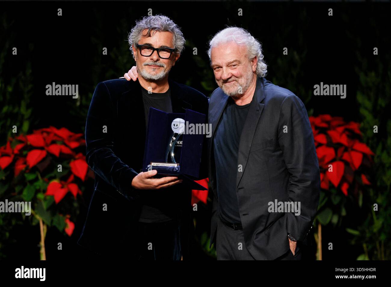 Monte Carlo, Monaco. 15th Nov, 2025. Paolo Genovese receives the Career Award from Giovanni Veronesi and Ezio Greggio the awards gala night held at Grimaldi Forum during 22nd Monte Carlo Film Festival on November 15, 2025 in Monte Carlo, Monaco. Photo Marco Piovanotto/ABACAPRESS.COM Credit: Abaca Press/Alamy Live News Stock Photo