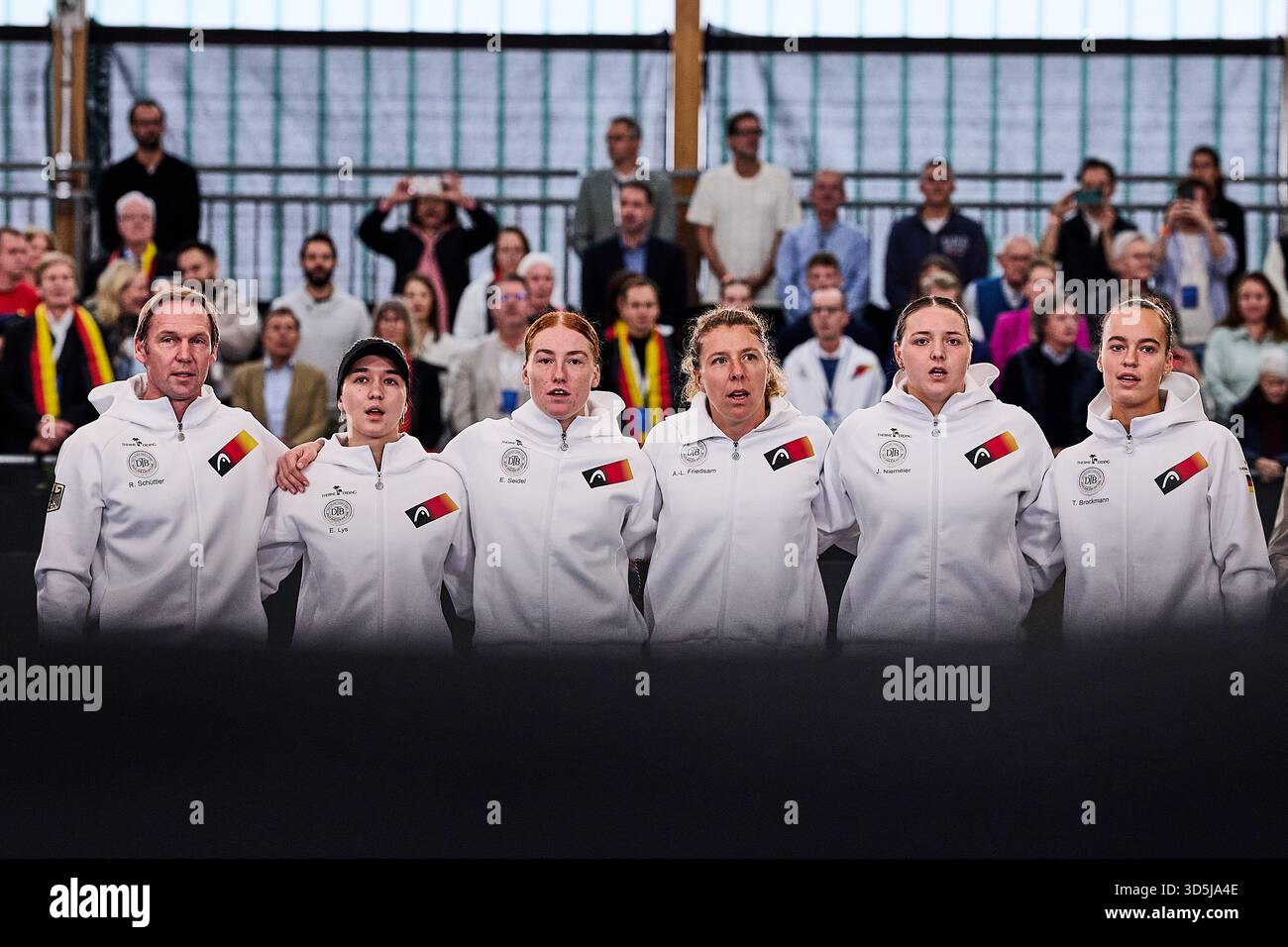 16 November 2025, Bavaria, Ismaning: Tennis, Women: Billie Jean King Cup - play-off round, Group F, group match round, Germany - Belgium. Rainer Schüttler, head of the German Billie Jean King Cup team (l), stands together with the players Eva Lys (l-r), Ella Seidel, Anna-Lena Friedsam, Jule Niemeier and Tessa Brockmann. Photo: Mathias Schulz/dpa Stock Photo