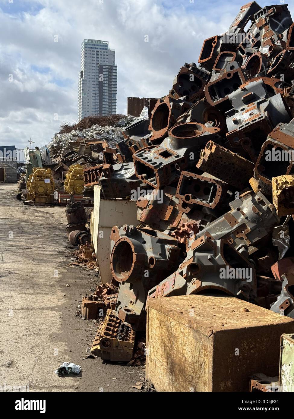 Large pile of discarded rusty engine parts in junkyard, industrial ...
