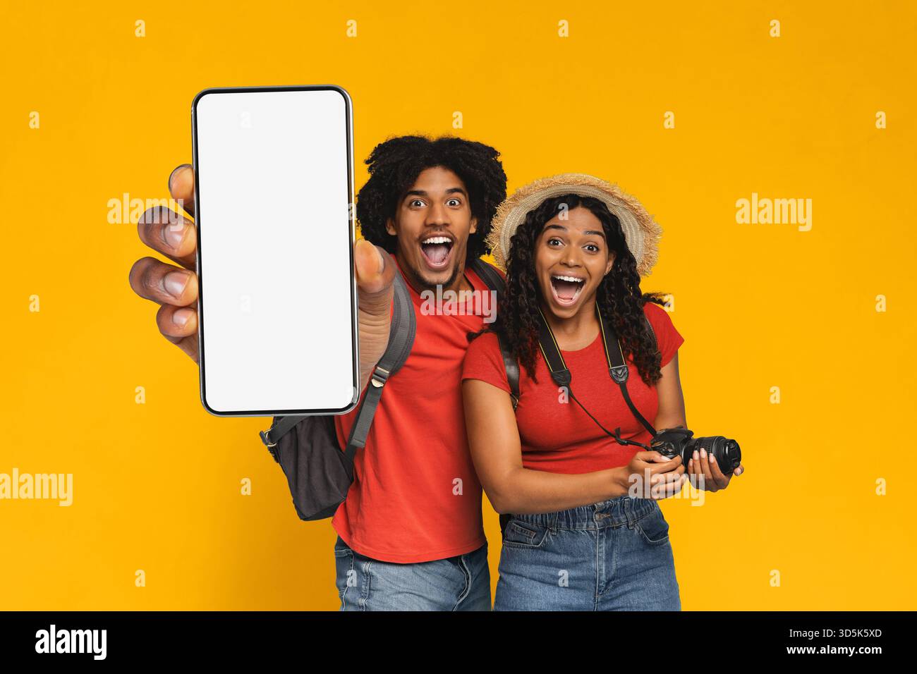 Happy Couple Cheerful While Taking Selfies With Smartphone in Bright Studio Setting Stock Photo