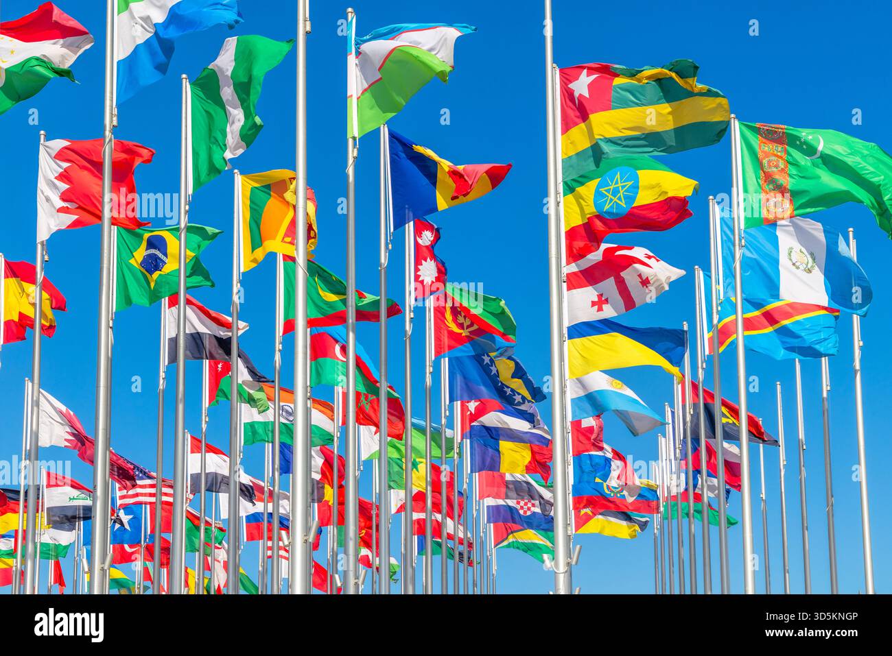 Multiple national flags from around the world waving in the wind ...