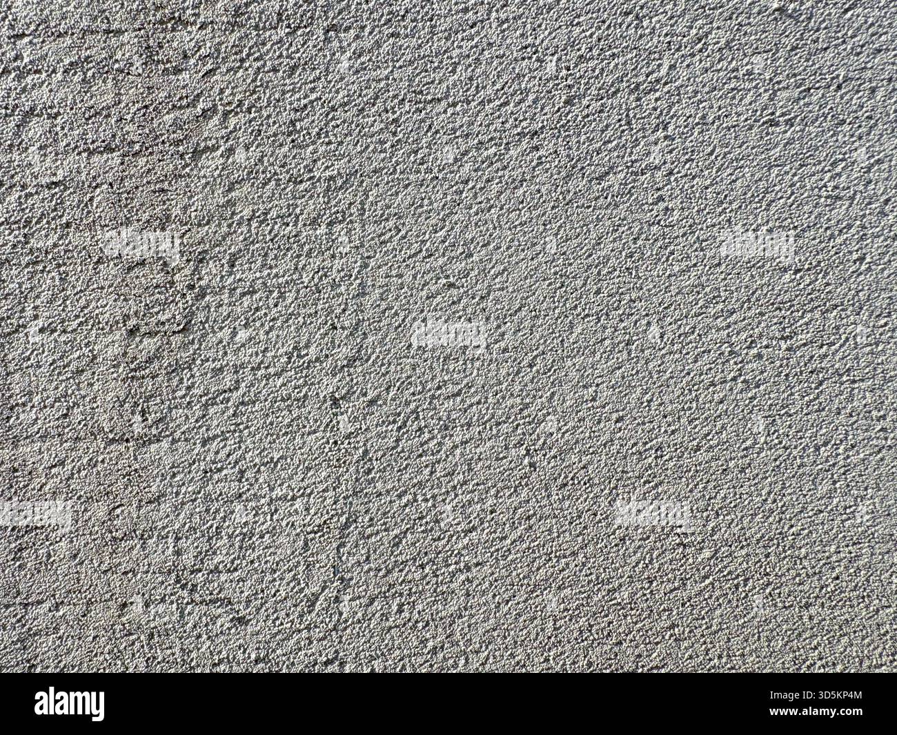 Monolithic wall background. Horizontal light gray grunge texture with copy space. Gray concrete texture. Stock Photo