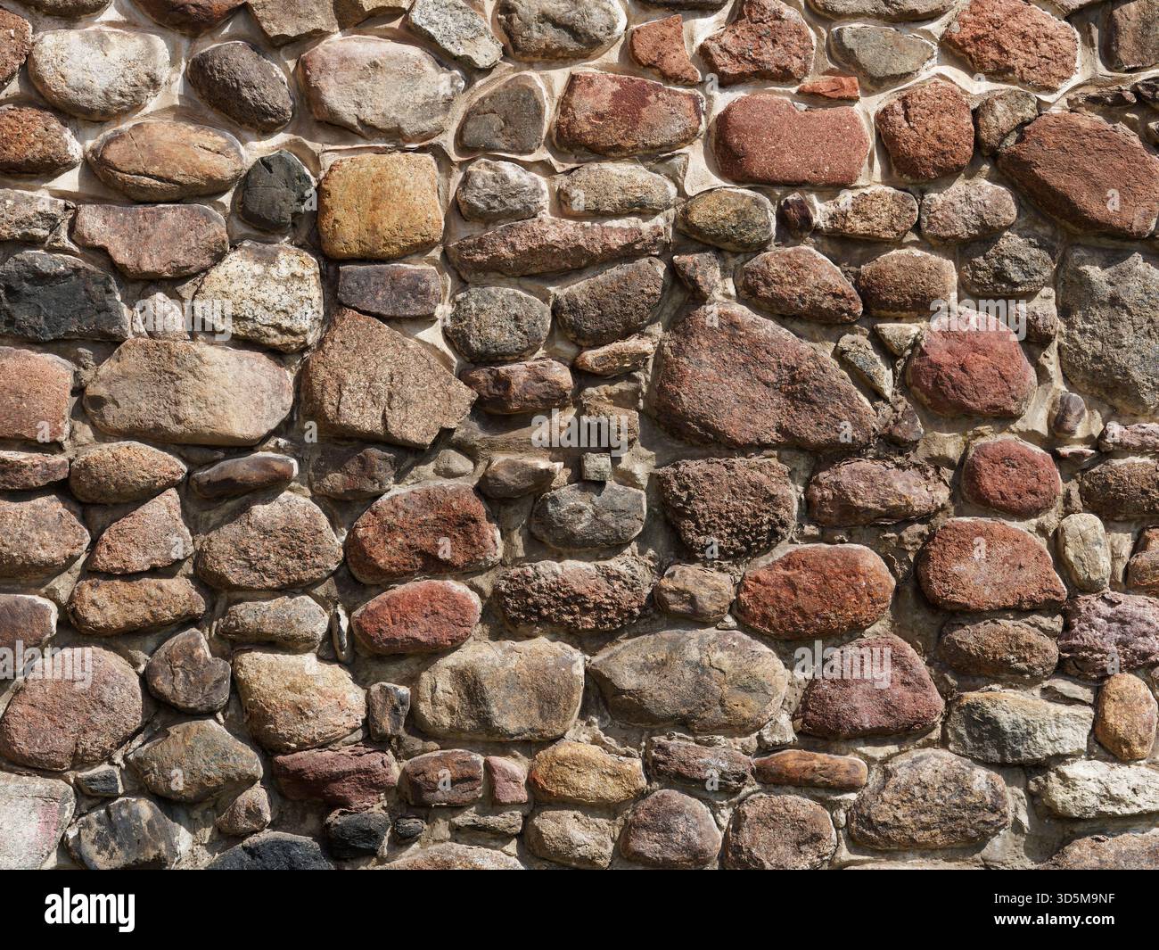 Wall made from concrete and stones, can be used as a background Stock Photo