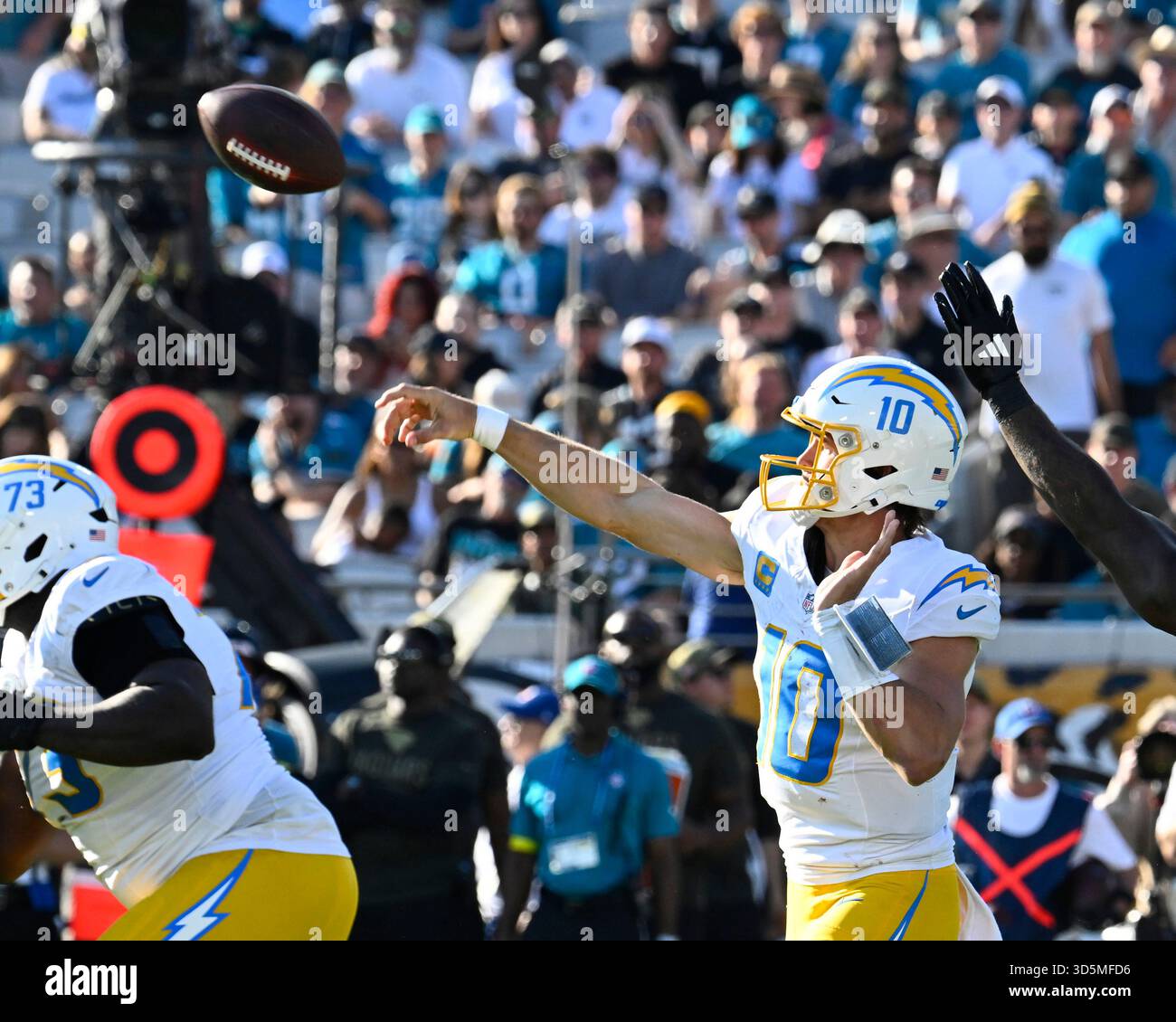 Chargers Quarterback Justin Herbert throws a pass for an interception ...