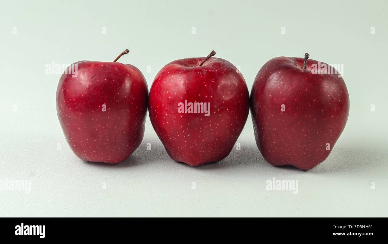 four red apples on a white background Stock Photo