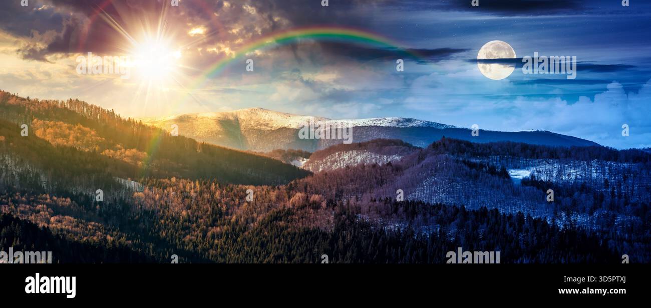 panorama of distant mountain ridge with snowy top. day and night time change concept. beautiful forested rolling hill of a countryside with sun and mo Stock Photo