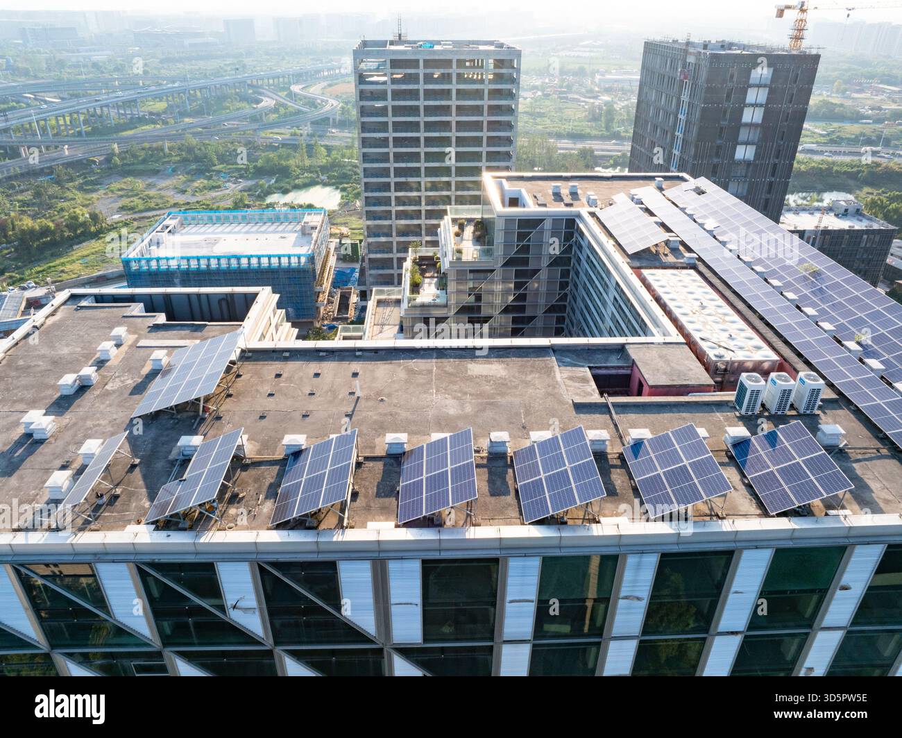 modern office building with solar power station on rooftop Stock Photo ...