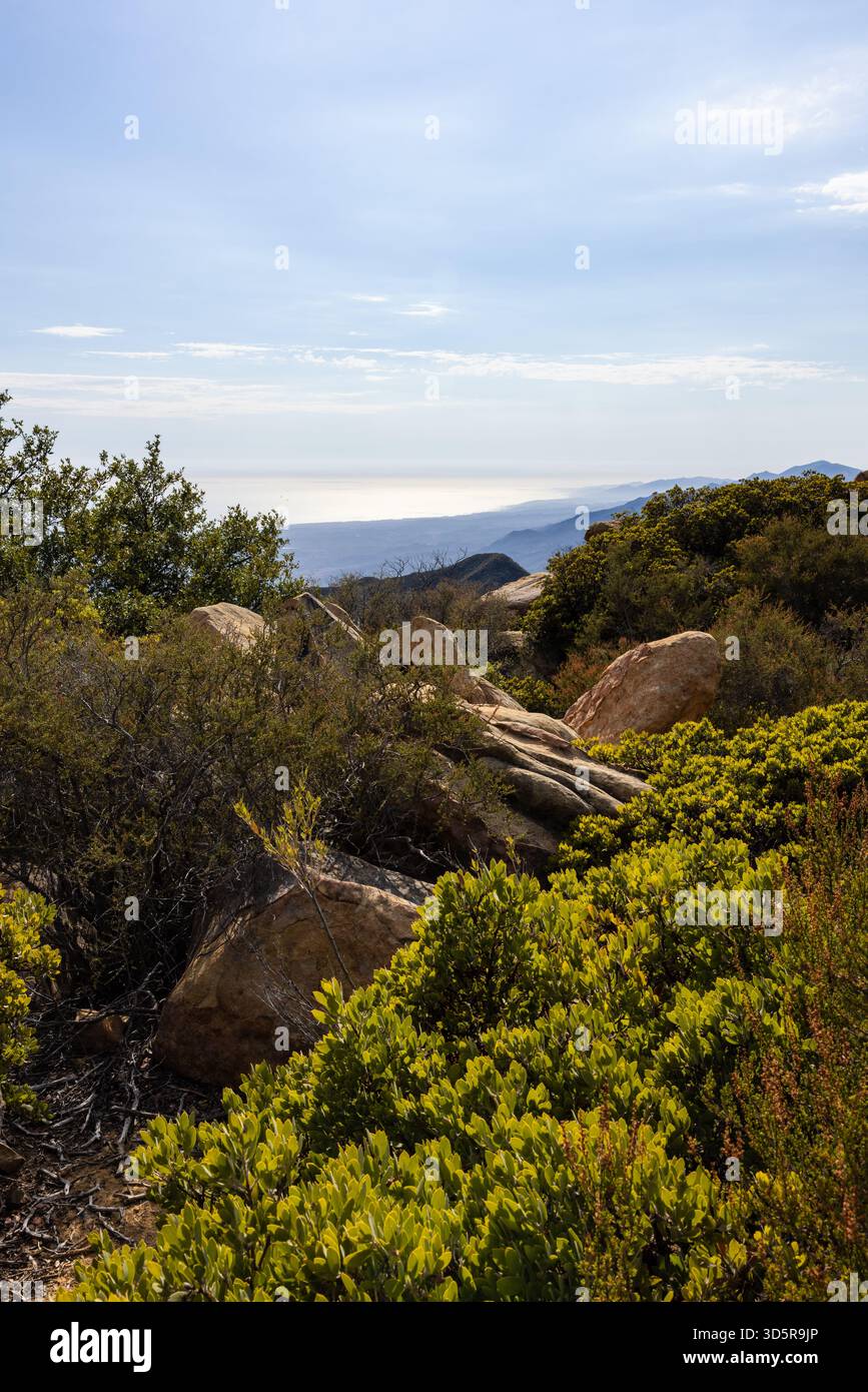 Coastal view over chaparral and boulders from the Santa Ynez Mountains in Santa Barbara County, California. Stock Photo
