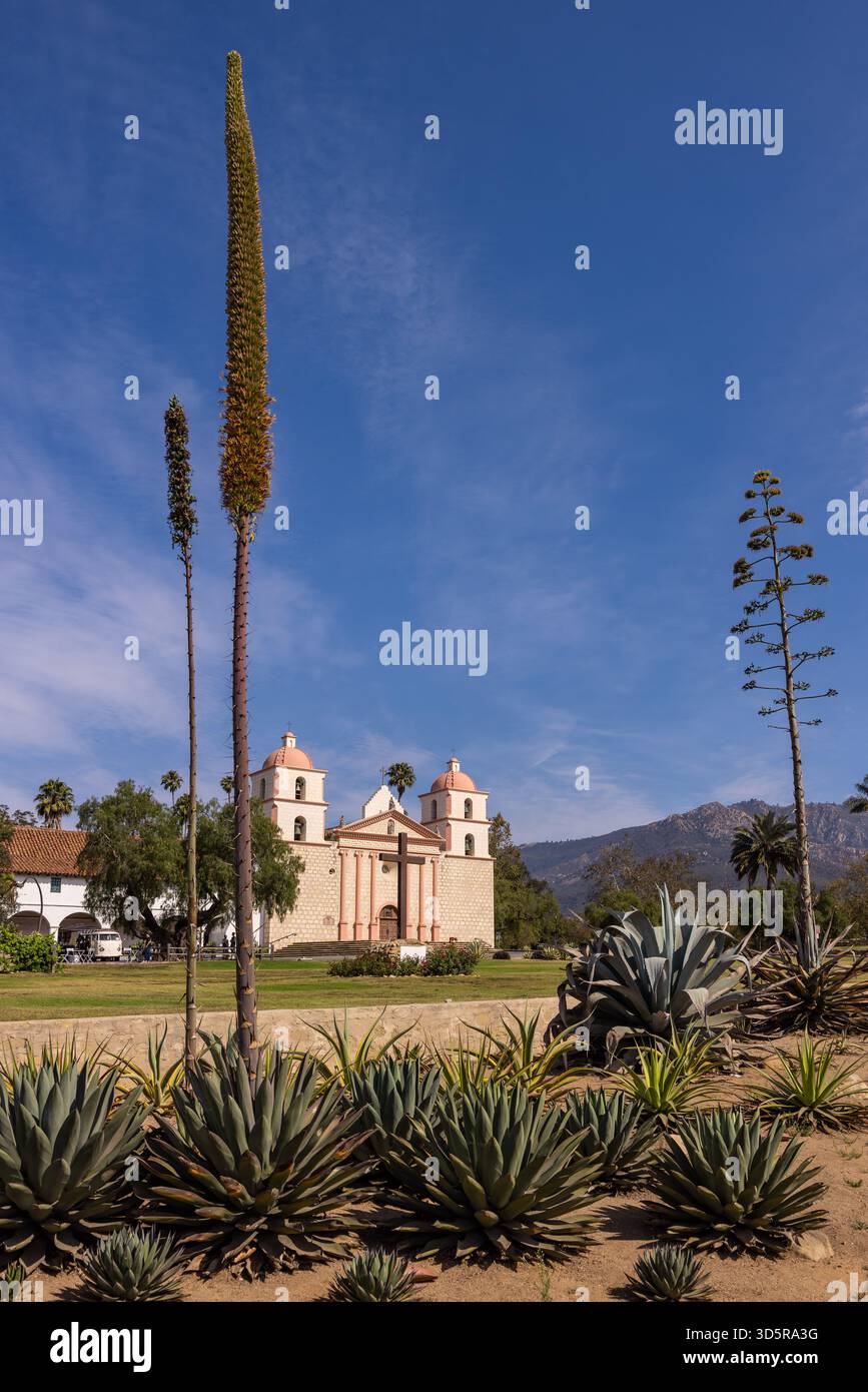Mission Santa Barbara framed by agave plants and tall flower stalks in Santa Barbara, California. Stock Photo