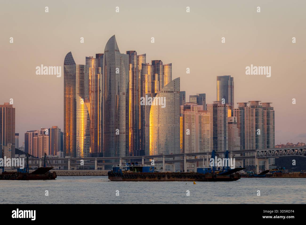 Beautiful skyscaper complex along a beach in Gwangan-li Busan, South Korea. Photo taken during sunset Stock Photo